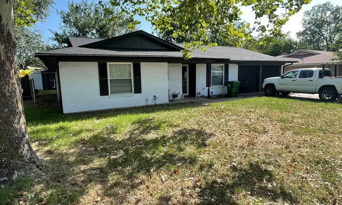 Professional roofing crew working on a residential roof in Sergeant Bluff